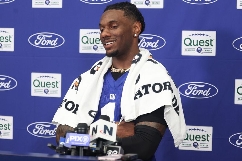 Jul 23, 2025; East Rutherford, NJ, USA; New York Giants wide receiver Malik Nabers (1) talks with media during training camp at Quest Diagnostics Training Center. Mandatory Credit: Vincent Carchietta-Imagn Images