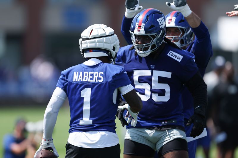 Jul 24, 2025; East Rutherford, NJ, USA; New York Giants wide receiver Malik Nabers (1) celebrates with offensive tackle James Hudson III (55) during training camp at Quest Diagnostics Training Center. Mandatory Credit: Vincent Carchietta-Imagn Images