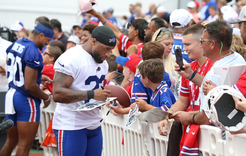 Bills running back Ray Davis signs autographs for fans during day three of Buffalo Bills training camp at St. John Fisher University Friday, July 25, 2025 in Pittsford, NY.