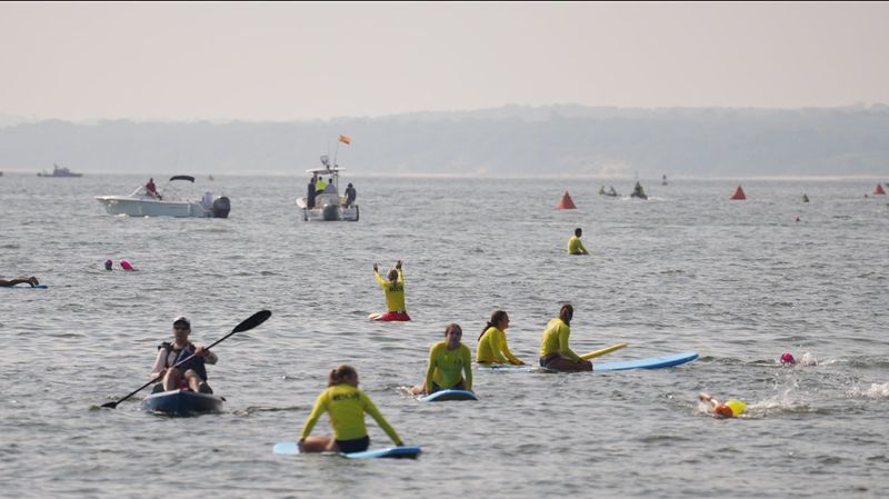 Swimmers exit the Long Island Sound at the Larchmont Shore Club during the 33rd annual Swim Across America Long Island Sound on Saturday, July 26, 2025.