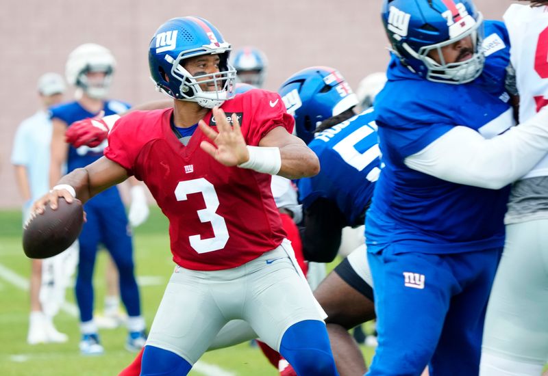 New York Giants quarterback Russell Wilson (3) prepares to throw a pass, Sunday, July 27, 2025, in East Rutherford.