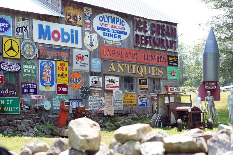 A great collection on the side of a barn at Finger Farm on Canopus Hollow Road in Putnam Valley July 29, 2025. Finger Farm is a nonworking farm with an unusual collection of vintage items and signs.