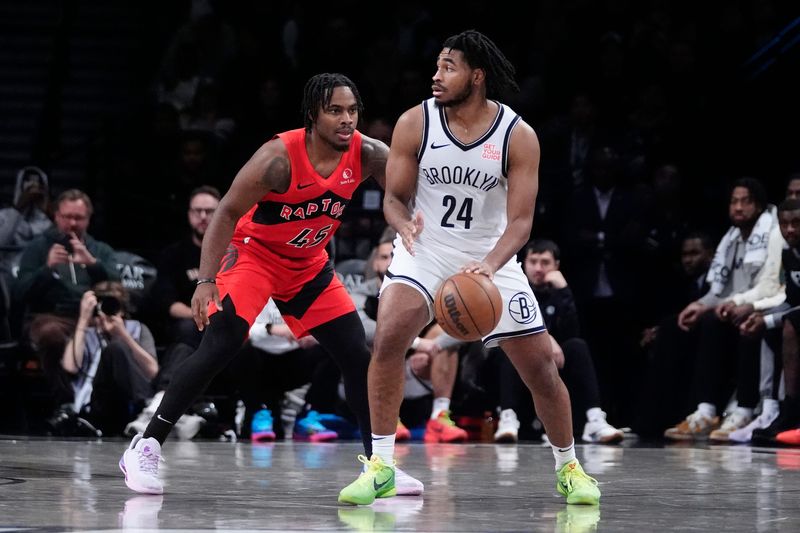 Oct 18, 2024; Brooklyn, New York, USA; Brooklyn Nets small guard Cam Thomas (24) dribbles the ball against Toronto Raptors forward Bruno Fernando (24) during the second half at Barclays Center. Mandatory Credit: Gregory Fisher-Imagn Images