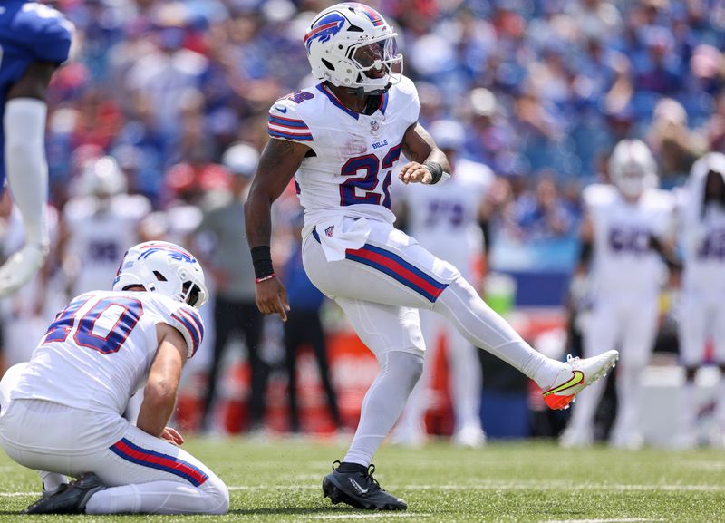Running back Ray Davis kicks an extra point during a preseason game against the New York Giants on Aug. 9, 2025.