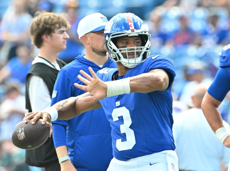 Aug 9, 2025; Orchard Park, New York, USA; New York Giants quarterback Russell Wilson (3) throws a pass before a game against the Buffalo Bills at Highmark Stadium. Mandatory Credit: Mark Konezny-Imagn Images