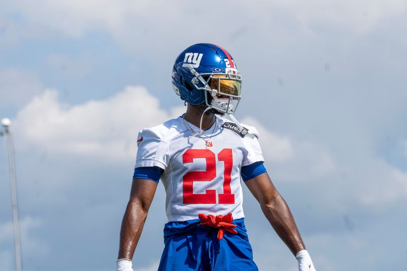 New York Giants cornerback Paulson Adebo (21) warms up during day one of the New York Giants training camp at Quest Diagnostics Giants Training Center in East Rutherford on Wednesday, July 23, 2025.