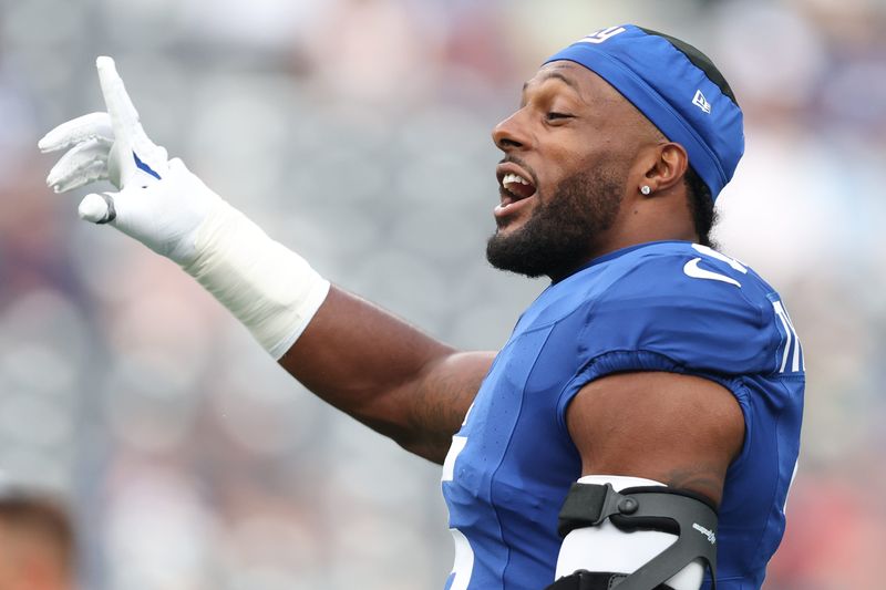 Aug 16, 2025; East Rutherford, New Jersey, USA; New York Giants linebacker Kayvon Thibodeaux (5) looks on before the preseason game against the New York Jets at MetLife Stadium. Mandatory Credit: Vincent Carchietta-Imagn Images