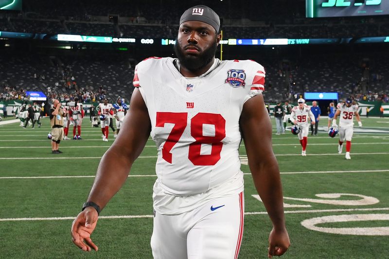 Aug 24, 2024; East Rutherford, New Jersey, USA; New York Giants offensive tackle Andrew Thomas (78) walks off the field following the game against the New York Jets at MetLife Stadium. Mandatory Credit: Rich Barnes-USA TODAY Sports