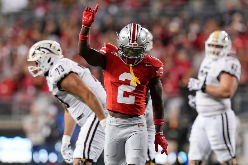 Ohio State safety Caleb Downs celebrates a play against Western Michigan.