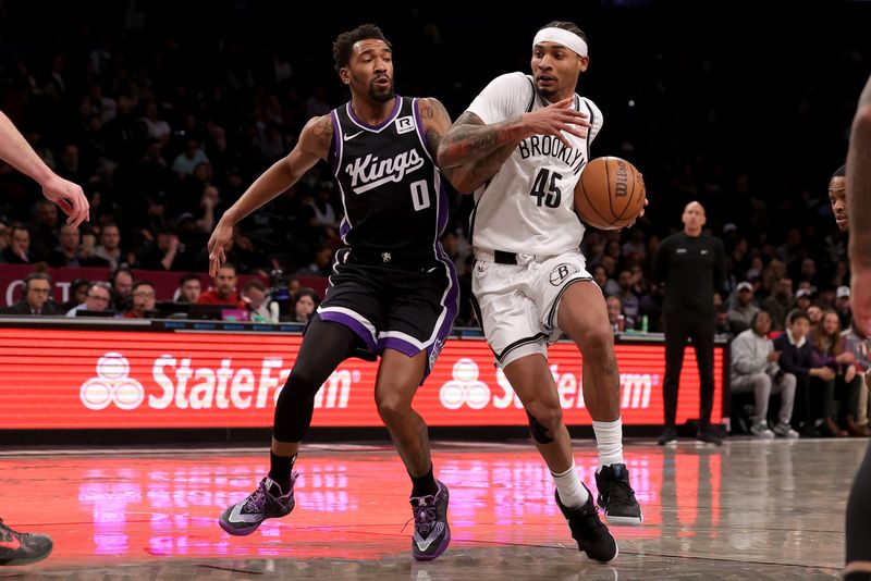 Jan 27, 2025; Brooklyn, New York, USA; Brooklyn Nets guard Keon Johnson (45) drives to the basket against Sacramento Kings guard Malik Monk (0) during the first quarter at Barclays Center. Mandatory Credit: Brad Penner-Imagn Images