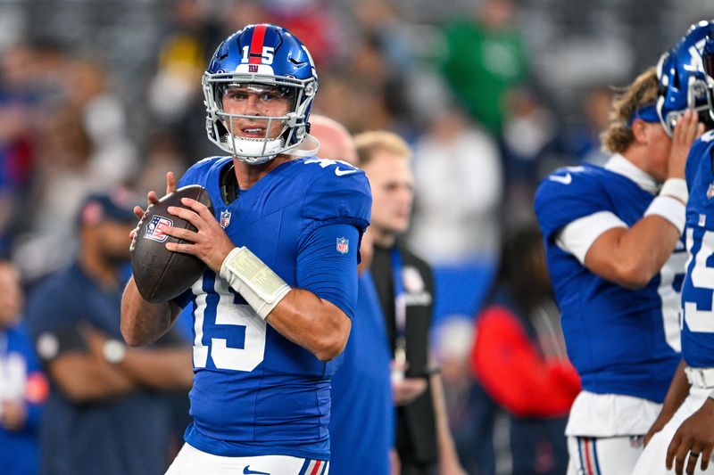 Aug 21, 2025; East Rutherford, New Jersey, USA; New York Giants quarterback Tommy DeVito (15) warms up before the game against the New England Patriots at MetLife Stadium. Mandatory Credit: Mark Smith-Imagn Images