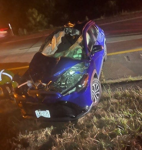 A 2025 Toyota Corolla shows extensive front end damage after the vehicle struck a Holstein dairy cow that had wandered into an I-86 lane of traffic on Aug. 21, 2025 in the Chemung County Town of Ashland.