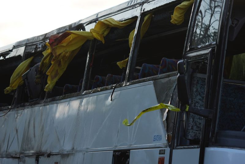 The tour bus involved in a deadly crash on the New York State Thruway near Pembroke is removed from the scene Friday evening.