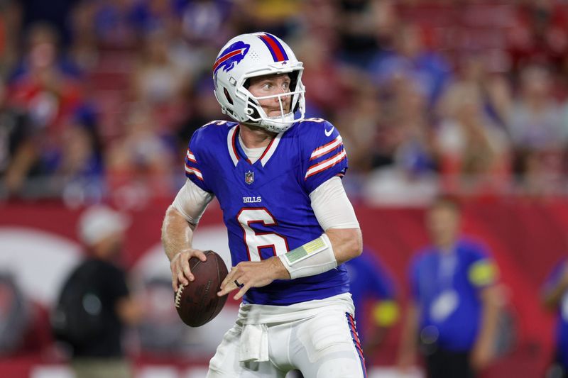 Aug 23, 2025; Tampa, Florida, USA; Buffalo Bills quarterback Shane Buechele (6) drops back to pass against the Tampa Bay Buccaneers in the third quarter at Raymond James Stadium. Mandatory Credit: Nathan Ray Seebeck-Imagn Images