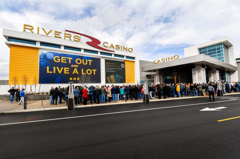 People line up for the Feb. 8, 2017, opening of the Rivers Casino in Schenectady, one of three new casinos to open in New York state that year. The new casinos have struggled to meet revenue projections in their first few months and some believe a saturated market is a contributing factor.