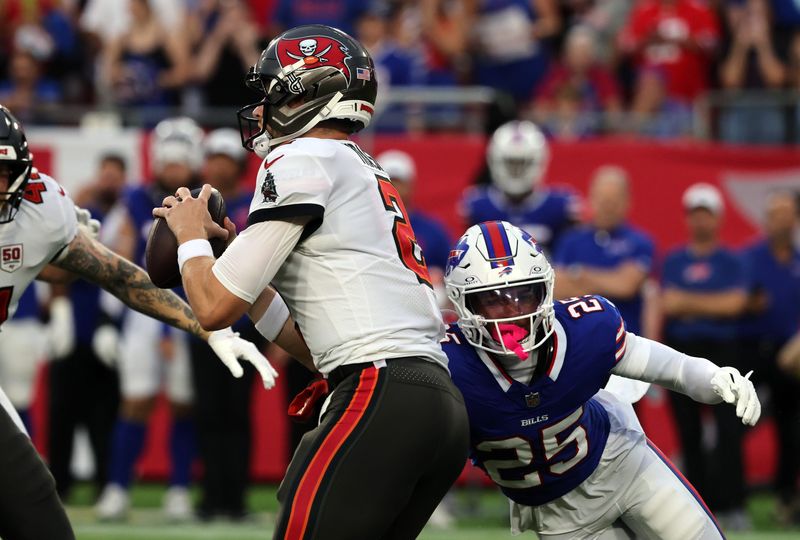 Aug 23, 2025; Tampa, Florida, USA; Buffalo Bills cornerback Daequan Hardy (25) rushes Tampa Bay Buccaneers quarterback Kyle Trask (2) during the first quarter at Raymond James Stadium. Mandatory Credit: