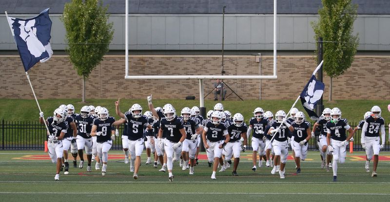 The Pittsford Panthers charge onto the field to face Victor during their Section V football season opener at the Teddi Bowl 2025, held at St. John Fisher University Thursday, Sept. 4, 2025.