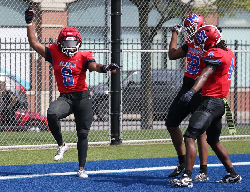 Monroe’s Jermaine Montgomery dances in the end zone as he celebrates with teammates after scoring a touchdown on a Rochester Prep fumble recovery in the second quarter during their Section V football season opener at James Monroe High School Saturday, Sept. 6, 2025.