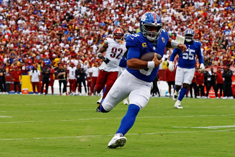 Sep 7, 2025; Landover, Maryland, USA; New York Giants quarterback Russell Wilson (3) runs the ball during the first quarter against the Washington Commanders at Northwest Stadium. Mandatory Credit: Peter Casey-Imagn Images