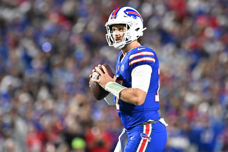 Sep 7, 2025; Orchard Park, New York, USA; Buffalo Bills quarterback Josh Allen (17) looks to pass during the first quarter against the Baltimore Ravens at Highmark Stadium. Mandatory Credit: Mark Konezny-Imagn Images