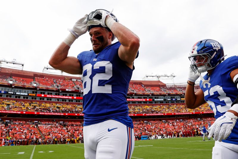 Sep 7, 2025; Landover, Maryland, USA; New York Giants tight end Daniel Bellinger (82) warms up before the game against the Washington Commanders at Northwest Stadium. Mandatory Credit: Peter Casey-Imagn Images