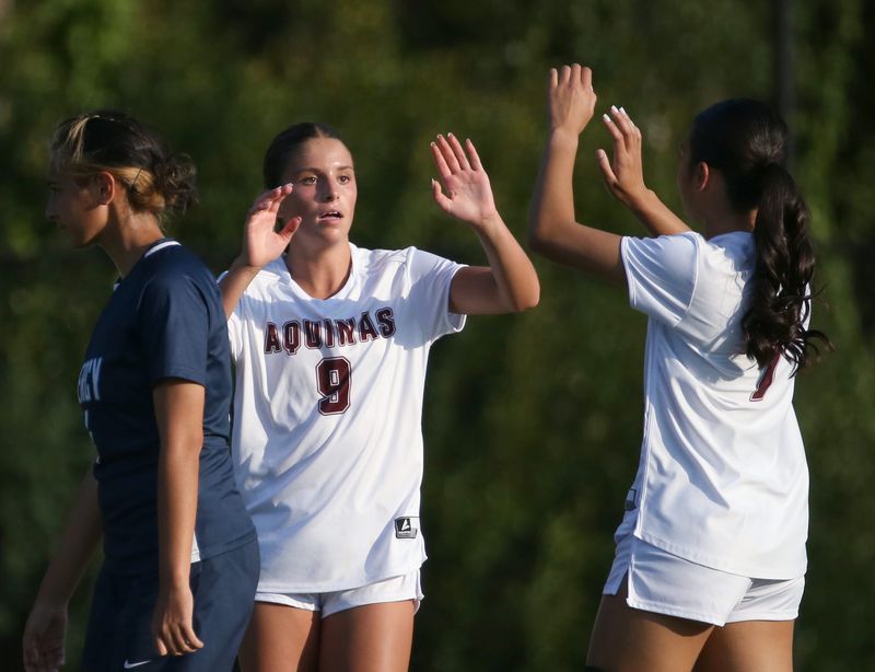 Aquinas’s Sienna Fallone celebrates her third goal of the second half with teammate Jada Ferrera during their Section V girls soccer game Tuesday, Sept. 9, 2025 at Our Lady of Mercy.