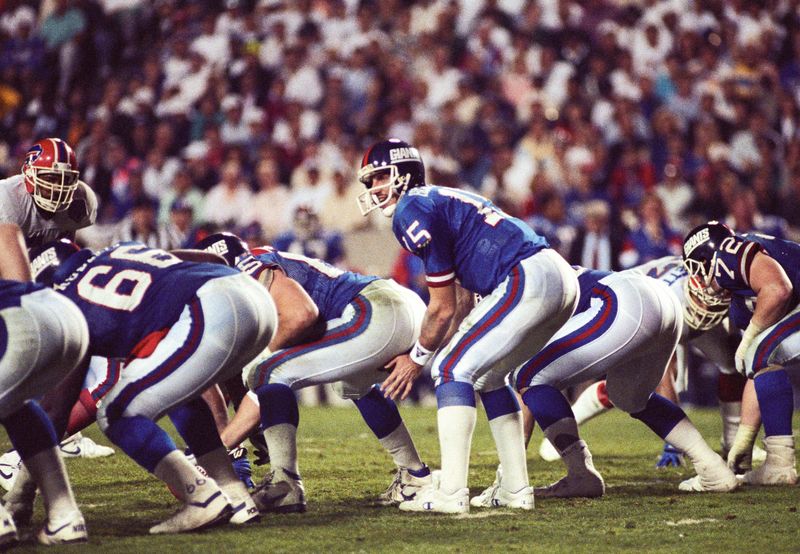 Jan 27, 1991; Tampa, FL, USA; FILE PHOTO; New York Giants quarterback Jeff Hostetler (15) under center Bart Oates (65) during Super Bowl XXV against the Buffalo Bills at Tampa Stadium. The Giants defeated the Bills 19-20. Mandatory Credit: USA TODAY Sports