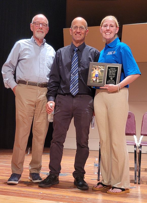 Former Maine-Endwell standout Kristin Lee Sotak was inducted into the New York State Sports Writers and Coaches Organization for Girls Sports NYS High School Girls Soccer Hall of Fame on Sept. 6 at Niskayuna High School. Pictured with her are NYSSCOGS co-president Perry Novak, center, and Steve Perkins, her coach at M-E.