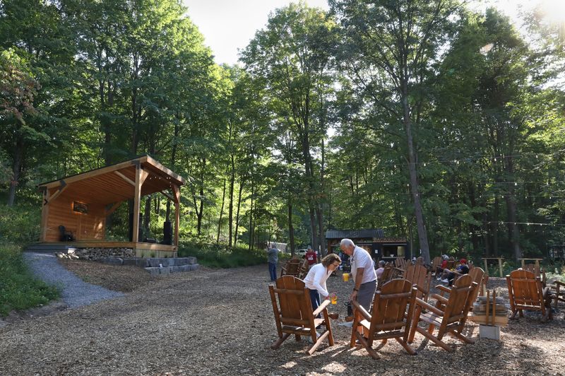 Finding the perfect seat at the newly opened Backwoods by Kettle Ridge Farm in Fairport Thursday, Sept. 11, 2025.