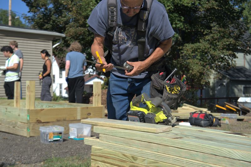 Volunteers from Habitat for Humanity, Binghamton University and United Way came out to build Johnson City's second community garden through VINES at 179 Floral Avenue.