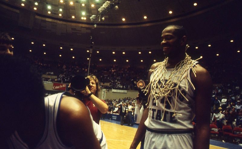 Former Memphis State star Keith Lee wears the net around his neck after the Tigers clinched the Metro Conference regular-season crown against Louisville on March 2, 1985.

Keith Net Metro