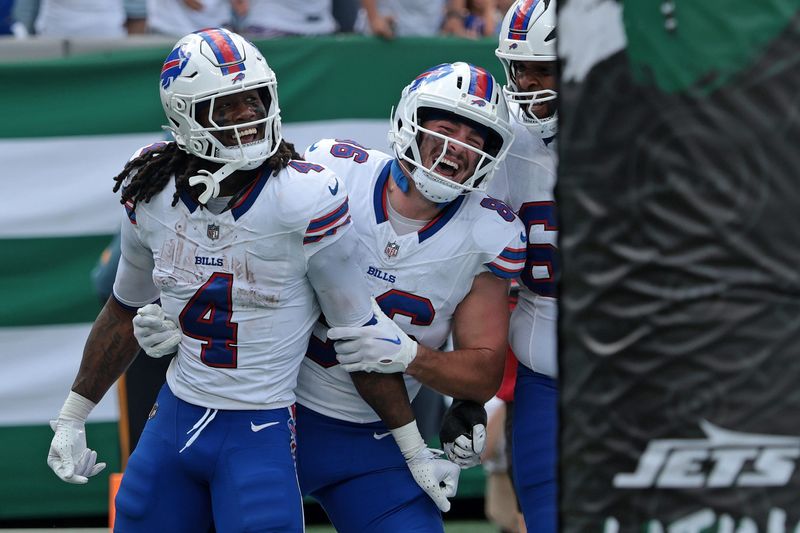 Buffalo Bills running back James Cook (4) reacts after rushing the ball for a touchdown against the New York Jets during the first half at MetLife Stadium. Mandatory Credit: Vincent Carchietta-Imagn Images