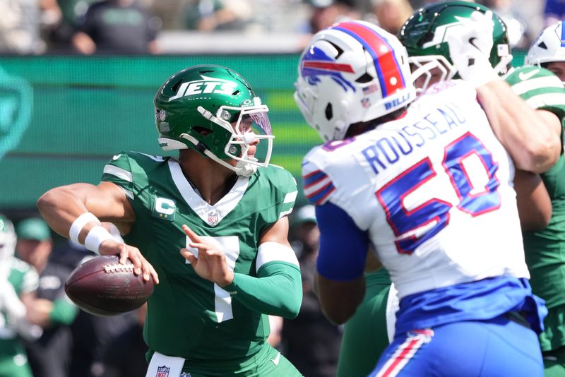 Sep 14, 2025; East Rutherford, New Jersey, USA; New York Jets quarterback Justin Fields (7) drops back to pass against the Buffalo Bills during the first half at MetLife Stadium. Mandatory Credit: Robert Deutsch-Imagn Images