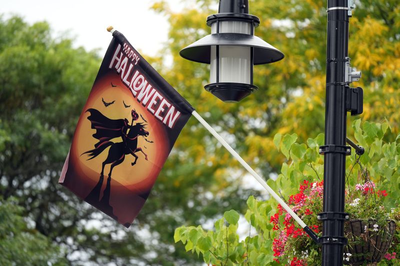 A Happy Halloween flag depicting the Headless Horseman hangs on a light pole on Beekman Avenue in Sleepy Hollow Sept. 17, 2025 as the village prepares for the Halloween season.
