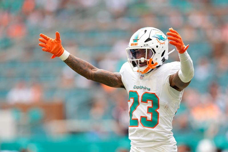 Sep 14, 2025; Miami Gardens, Florida, USA; Miami Dolphins cornerback Jack Jones (23) reacts on the field against the New England Patriots during the third quarter at Hard Rock Stadium.