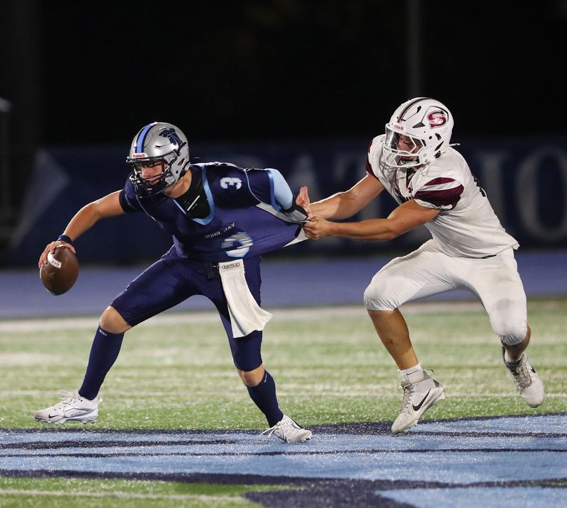 Scarsdale’s Arbri Gjyriqi gets a hold of John Jay East Fishkill’s Logan Lawrence during their game on September 19, 2025.