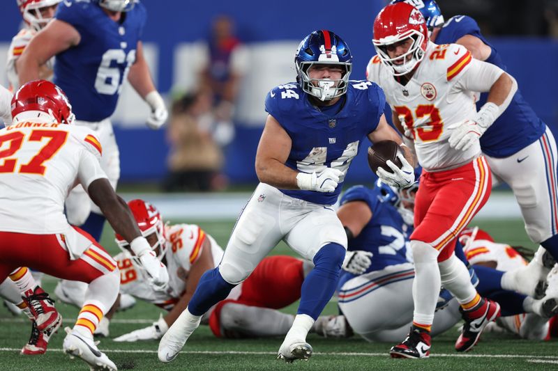 Sep 21, 2025; East Rutherford, New Jersey, USA; New York Giants running back Cam Skattebo (44) runs against the Kansas City Chiefs in the second quarter at MetLife Stadium. Mandatory Credit: Vincent Carchietta-Imagn Images