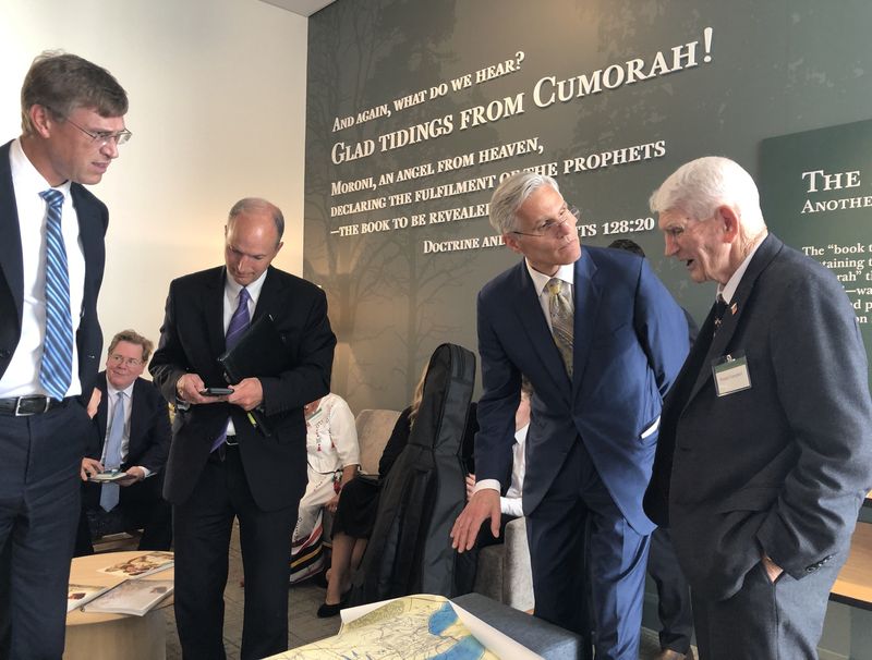 Members of The Church of Jesus Christ of Latter-day Saints enjoy looking over maps and other documents pertaining to the Hill Cumorah Historic Site during a dedication ceremony Sept. 21.