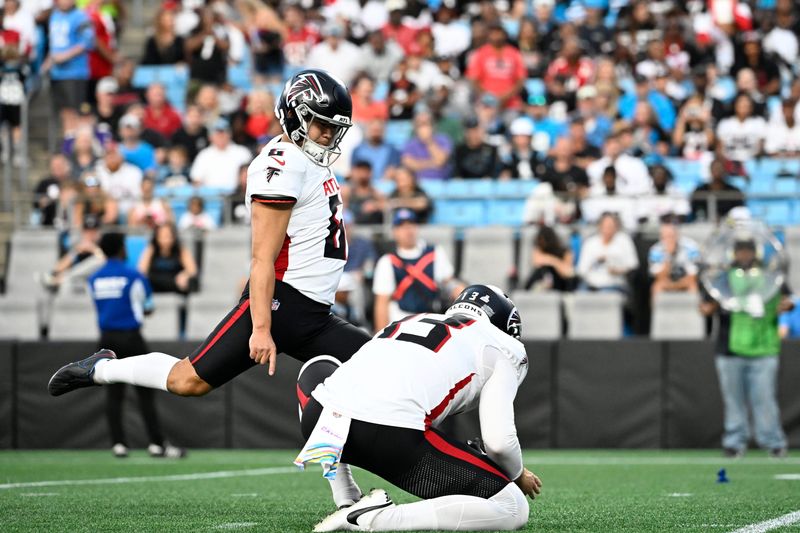 Oct 13, 2024; Charlotte, North Carolina, USA; Atlanta Falcons place kicker Younghoe Koo (6) kicks in the third quarter at Bank of America Stadium. Mandatory Credit: Bob Donnan-Imagn Images