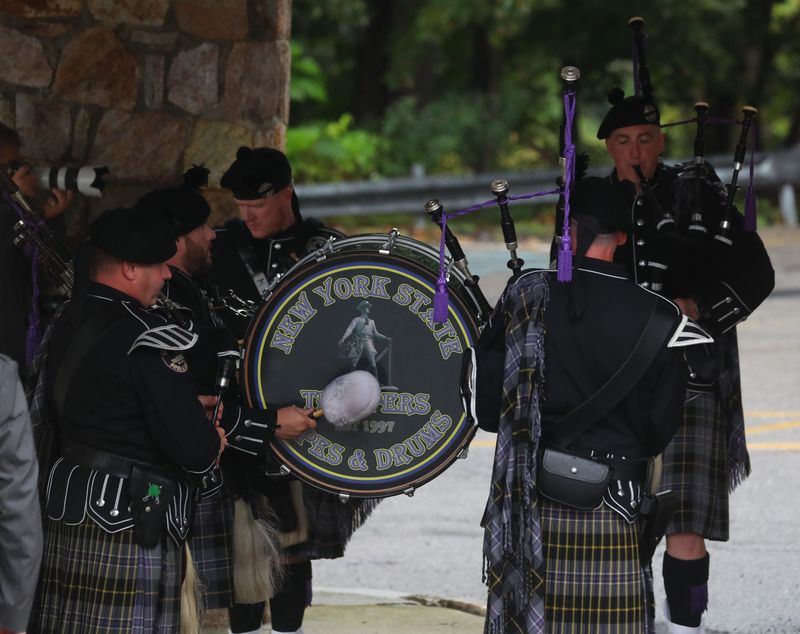 New York State Troopers Pipes & Drums play during the funeral of Sergeant Nigel Barnett in the Town of Poughkeepsie on September 25, 2025.
