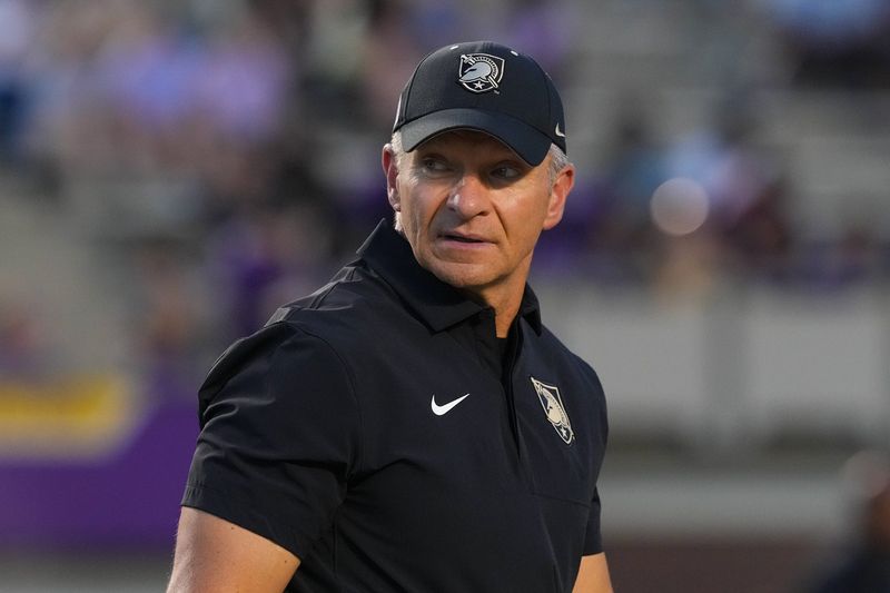 Sep 25, 2025; Greenville, North Carolina, USA; Army Black Knights head coach Jeff Monken looks on during the warmups against the East Carolina Pirates at Dowdy-Ficklen Stadium. Mandatory Credit: James Guillory-Imagn Images