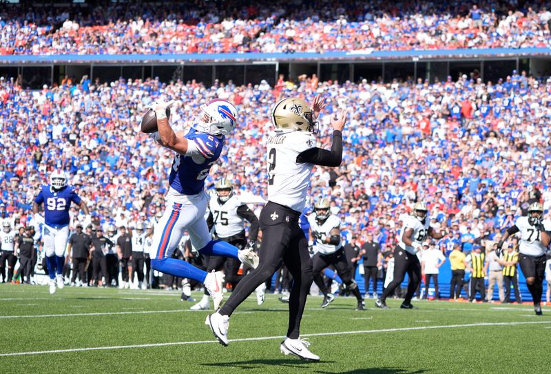 Sep 28, 2025; Orchard Park, New York, USA; Buffalo Bills safety Cole Bishop (24) intercepts a pass intended for New Orleans Saints quarterback Spencer Rattler (2) during the second quarter at Highmark Stadium.