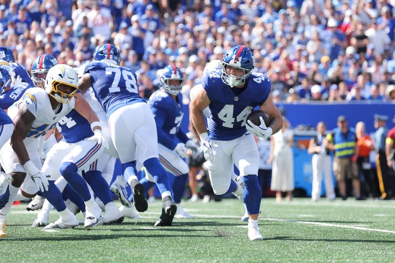 Sep 28, 2025; East Rutherford, New Jersey, USA; New York Giants running back Cam Skattebo (44) rushes during the second quarter against the Los Angeles Chargers at MetLife Stadium. Mandatory Credit: Brad Penner-Imagn Images