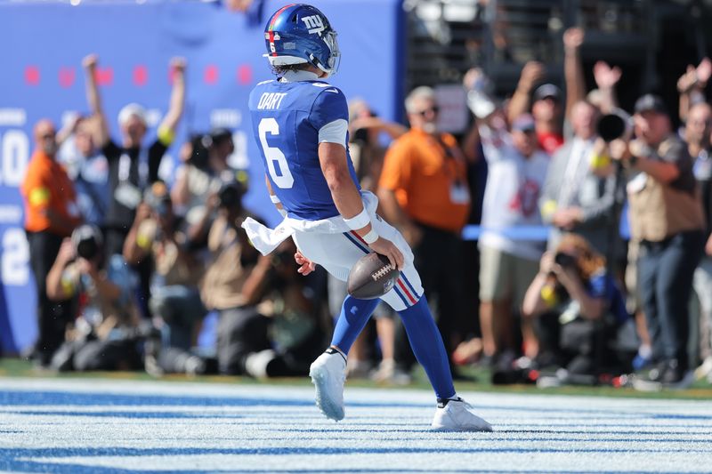 Sep 28, 2025; East Rutherford, New Jersey, USA; New York Giants quarterback Jaxson Dart (6) rushes for a touchdown during the first quarter against the Los Angeles Chargers at MetLife Stadium. Mandatory Credit: Brad Penner-Imagn Images