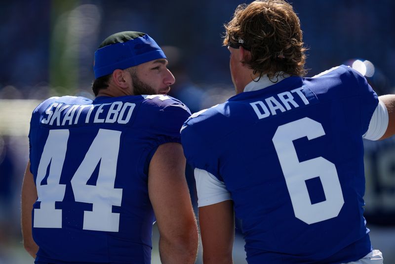New York Giants running back Cam Skattebo (44) and New York Giants quarterback Jaxson Dart (6) warm up before a game against the Los Angeles Chargers at MetLife Stadium, Sep 28, 2025, East Rutherford, NJ, USA.