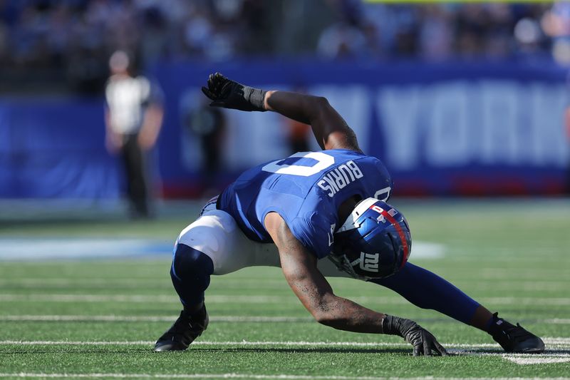 Sep 28, 2025; East Rutherford, New Jersey, USA; New York Giants linebacker Brian Burns (0) celebrates after sacking Los Angeles Chargers quarterback Justin Herbert (10) (not pictured) during the fourth quarter at MetLife Stadium. Mandatory Credit: Brad Penner-Imagn Images
