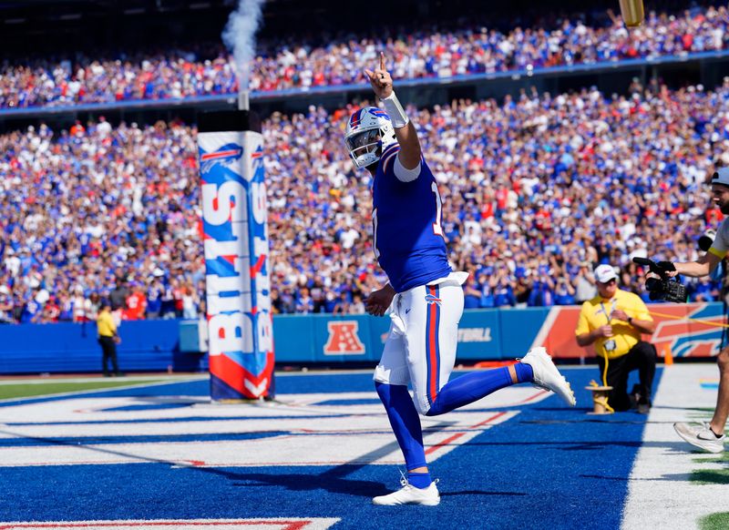 Sep 28, 2025; Orchard Park, New York, USA; Buffalo Bills quarterback Josh Allen (17) runs out prior to a game against the New Orleans Saints at Highmark Stadium. Mandatory Credit: Gregory Fisher-Imagn Images