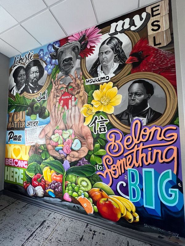 Based on the communities answers to, "What does the Bull’s Head neighborhood mean to you?", Shawn Dunwoody created a mural to go in the Bull's Head branch's conference room, which is the first of its kind for any ESL branch.
