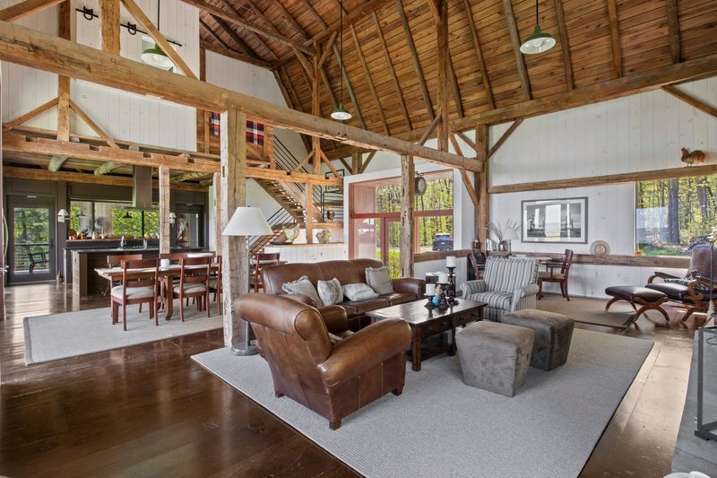 The main living area inside a renovated barn at 9183 County Road 76 in Steuben County has nearly 30-foot ceilings.
