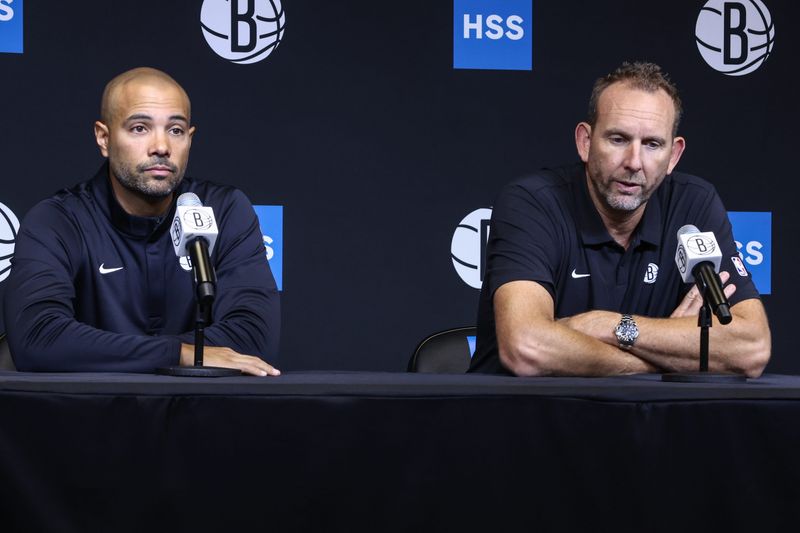 Sep 23, 2025; Brooklyn, NY, USA; Brooklyn Nets head coach Jordi Fernandez (l) and general manager Sean Marks (r) speak at Media Day. Mandatory Credit: Wendell Cruz-Imagn Images